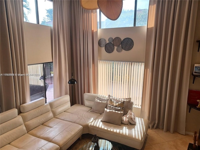 living room with a wealth of natural light and light tile patterned floors