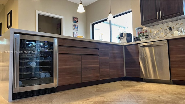 bar featuring decorative backsplash, dark brown cabinets, decorative light fixtures, dishwasher, and wine cooler