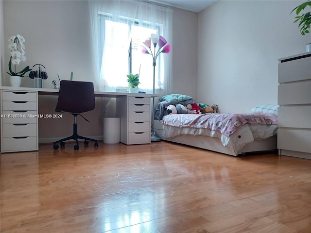 bedroom with light hardwood / wood-style floors