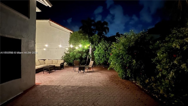 patio at night with an outdoor hangout area