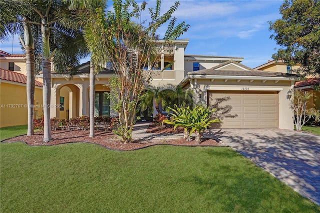 view of front of property with a garage, a balcony, and a front lawn