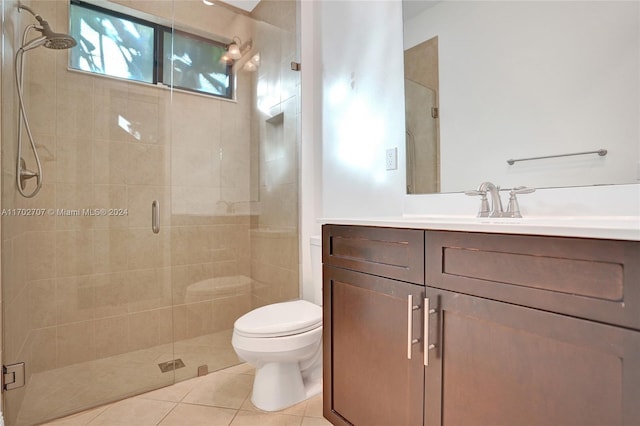 bathroom with walk in shower, tile patterned flooring, vanity, and toilet