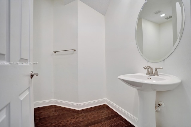 bathroom with wood-type flooring