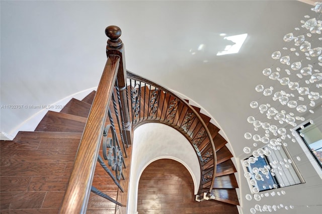 staircase featuring hardwood / wood-style flooring