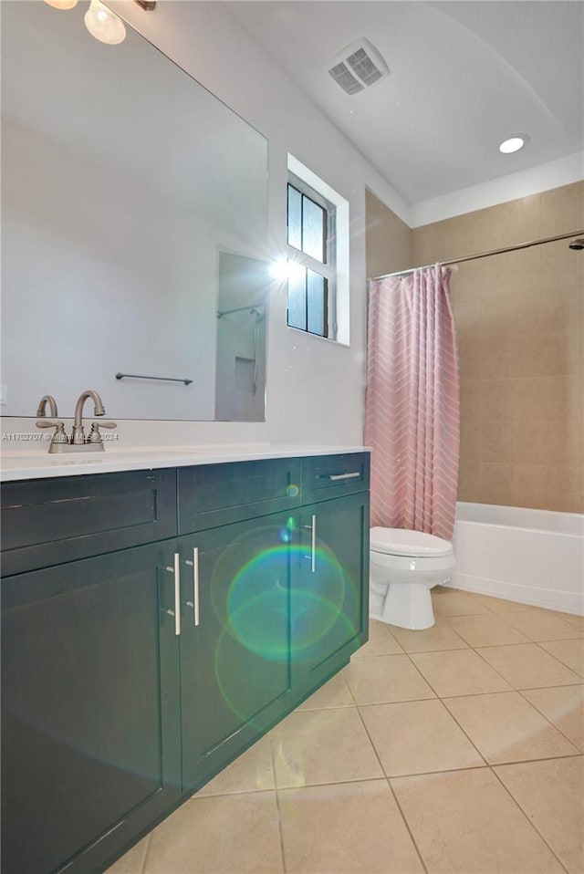 full bathroom featuring tile patterned floors, vanity, shower / tub combo, and toilet