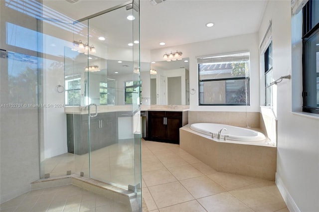 bathroom featuring tile patterned flooring, vanity, and independent shower and bath