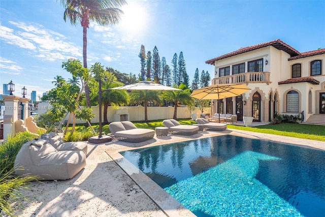 view of swimming pool with a patio area