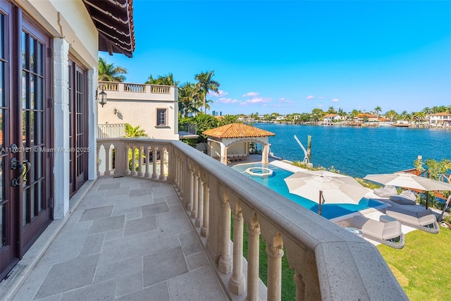 balcony featuring a water view