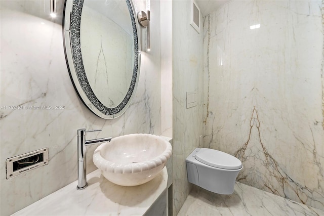 bathroom featuring sink and toilet