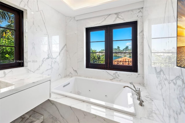 bathroom with tiled bath