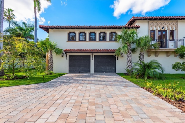 mediterranean / spanish-style home featuring a garage