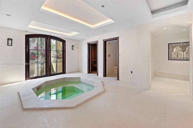 view of pool featuring an indoor hot tub