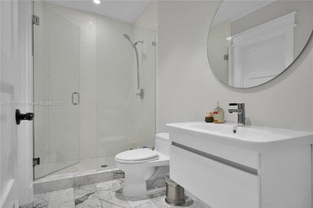 bathroom with vanity, a shower with shower door, and toilet