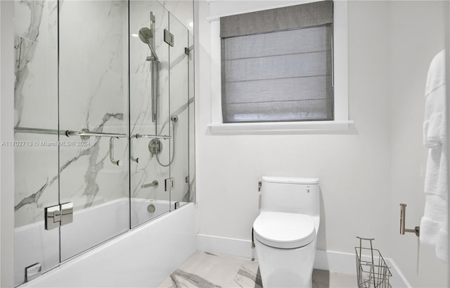 bathroom featuring toilet and enclosed tub / shower combo