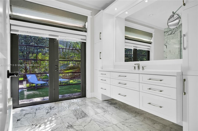 bathroom featuring french doors and vanity