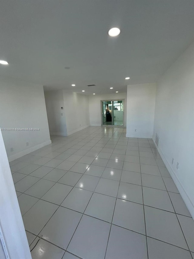 spare room featuring light tile patterned floors