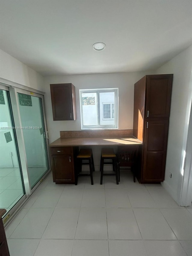 kitchen with light tile patterned floors