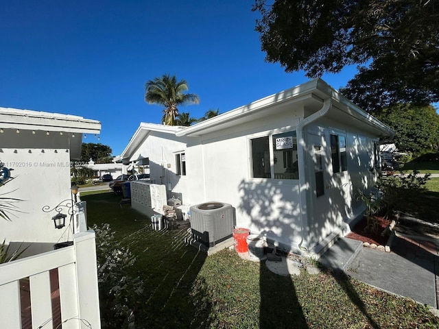 view of home's exterior featuring central AC unit