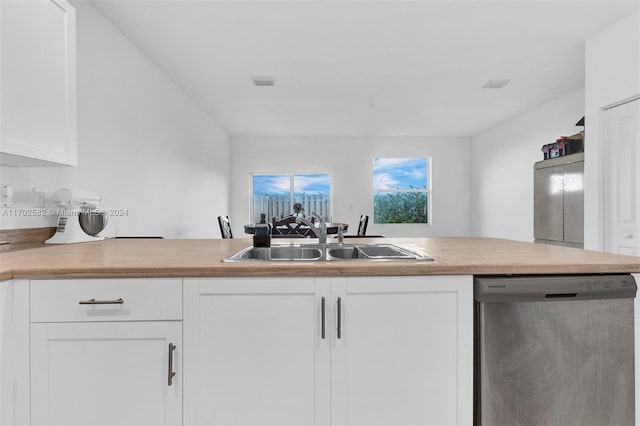 kitchen featuring white cabinetry, sink, and stainless steel dishwasher