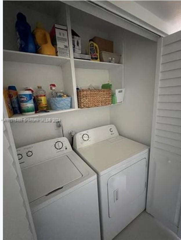 laundry room with washer and dryer