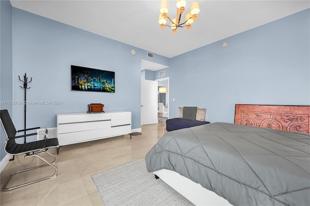 tiled bedroom with a chandelier