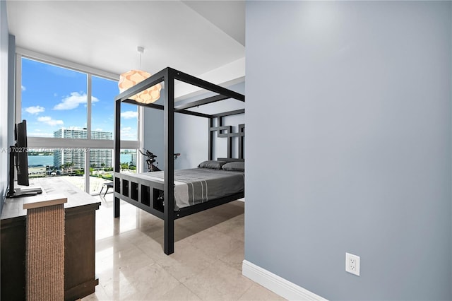 bedroom featuring expansive windows