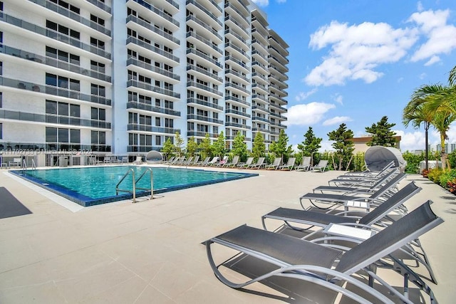 view of swimming pool featuring a patio area