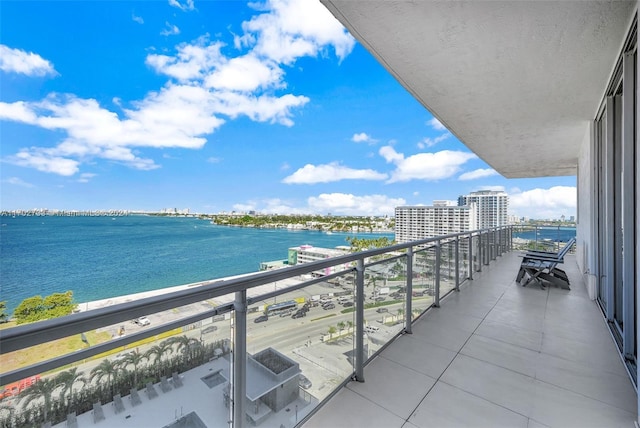 balcony featuring a water view