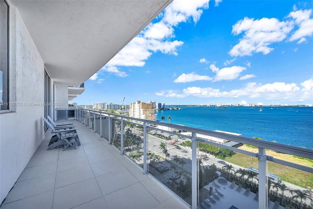 balcony featuring a water view