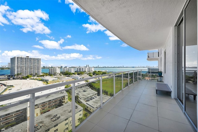 balcony featuring a water view