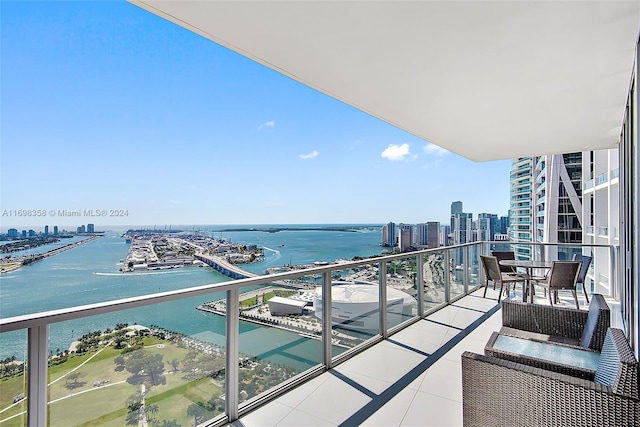 balcony featuring a water view