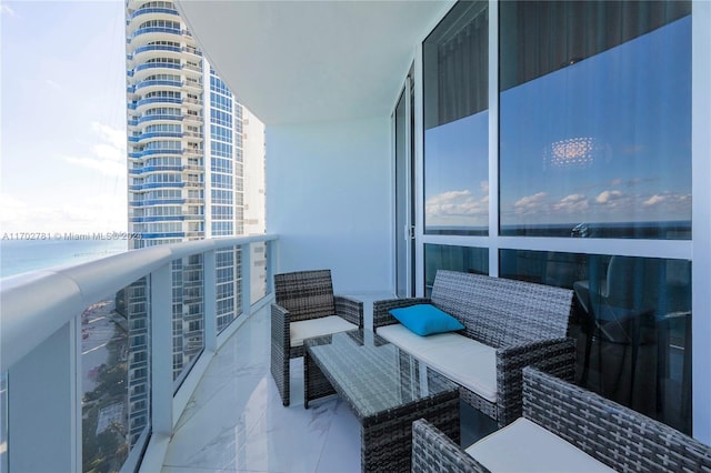 balcony featuring a water view