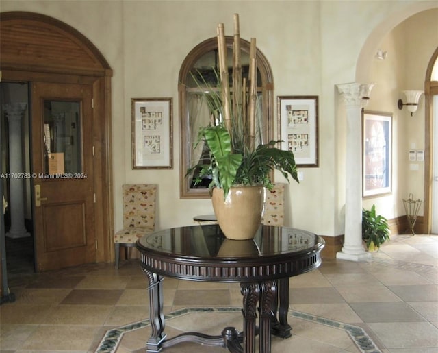 interior space with ornate columns and a towering ceiling