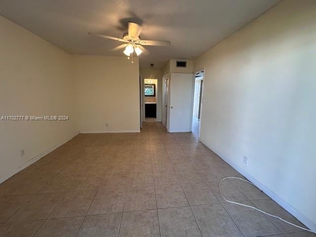 unfurnished room with ceiling fan