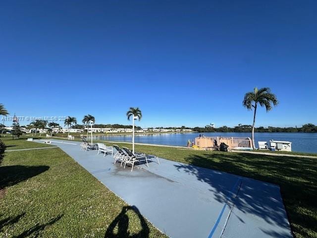 exterior space with a yard and a water view