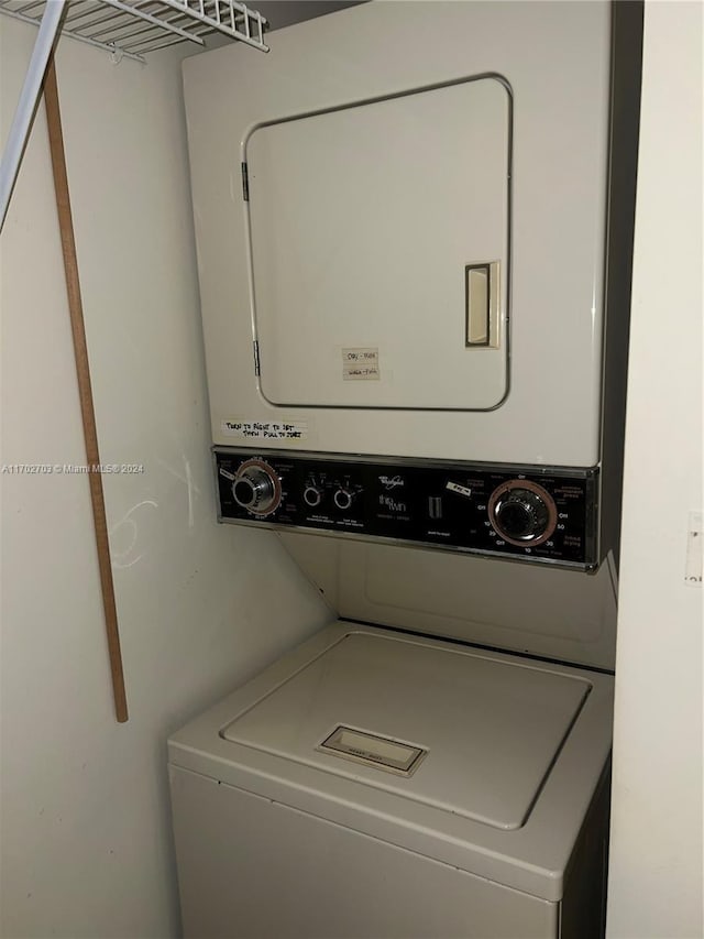 laundry area featuring stacked washing maching and dryer