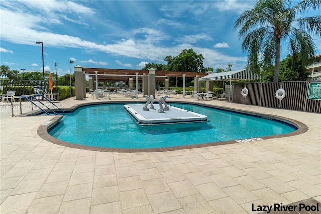 view of swimming pool with a patio area