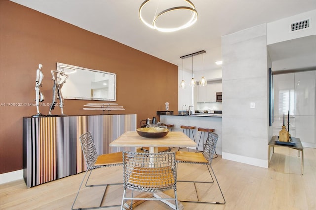 dining space featuring light hardwood / wood-style flooring