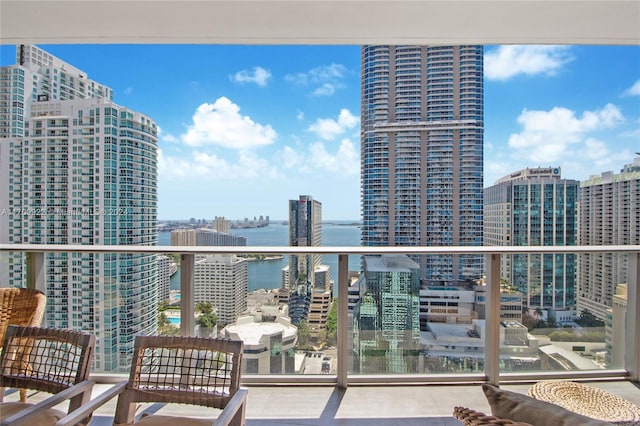 balcony featuring a water view