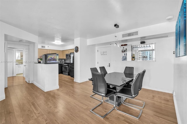 3530 Mystic Pointe Dr Unit 2907, Aventura, FL 33180 - dining area featuring light wood finished floors and baseboards