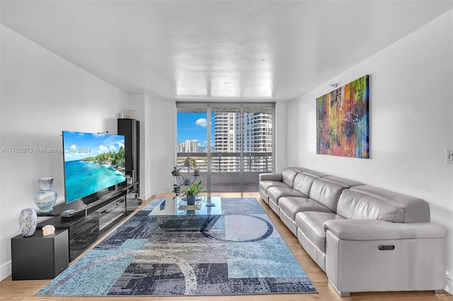 3530 Mystic Pointe Dr Unit 2907, Aventura, FL 33180 - living room featuring light wood-style floors and a wall of windows