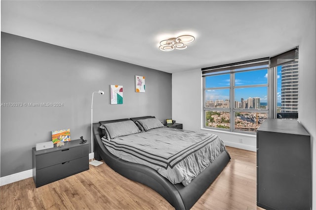 3530 Mystic Pointe Dr Unit 2907, Aventura, FL 33180 - bedroom with light wood-style floors and a city view