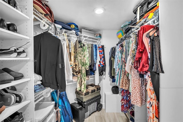 walk in closet featuring light hardwood / wood-style flooring