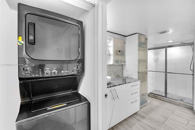 3530 Mystic Pointe Dr Unit 2907, Aventura, FL 33180 - washroom with stacked washer and clothes dryer