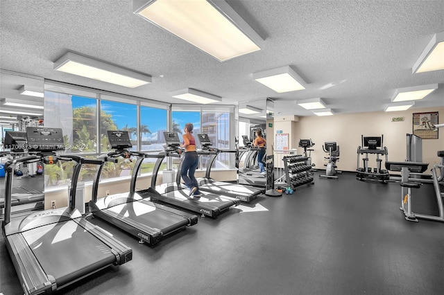 gym featuring a textured ceiling