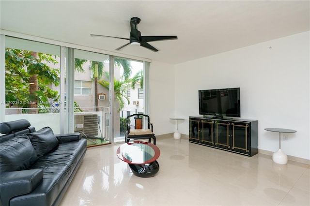 living room featuring ceiling fan and light tile patterned flooring