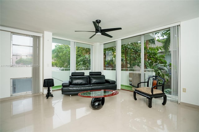 sunroom featuring ceiling fan