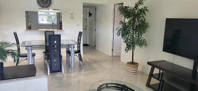 dining area featuring light tile patterned floors