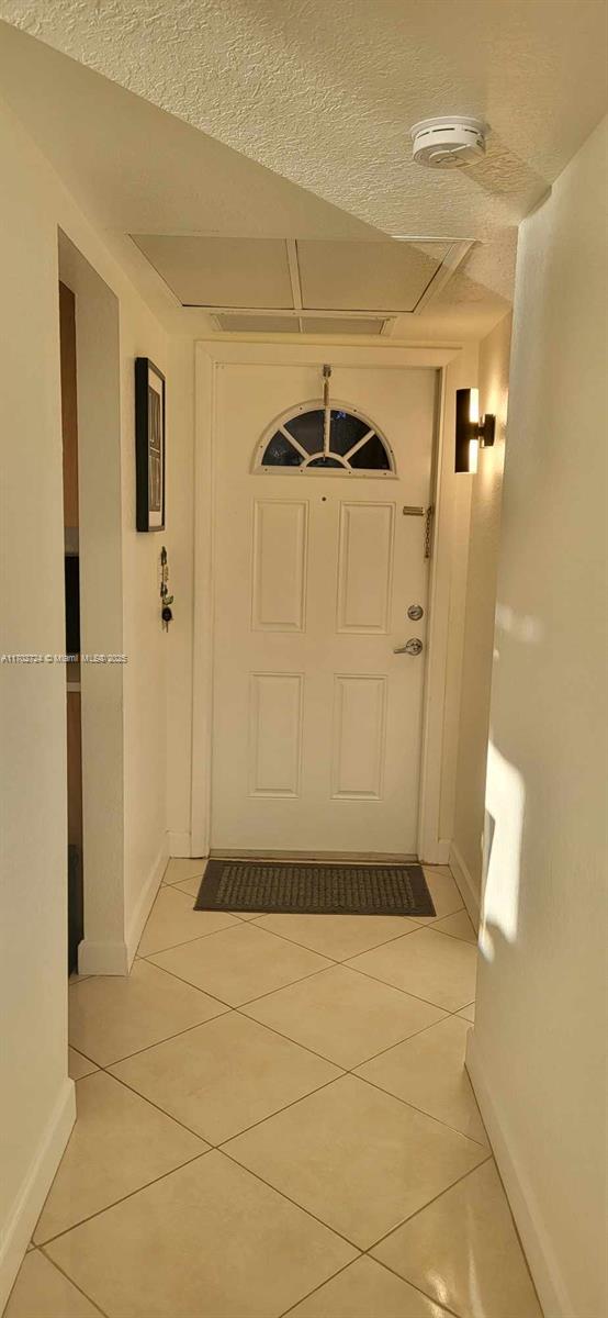 interior space with light tile patterned floors