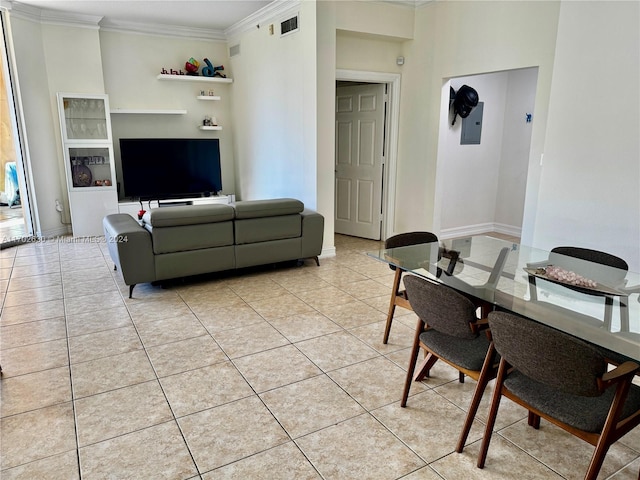 living room with crown molding and light tile patterned flooring